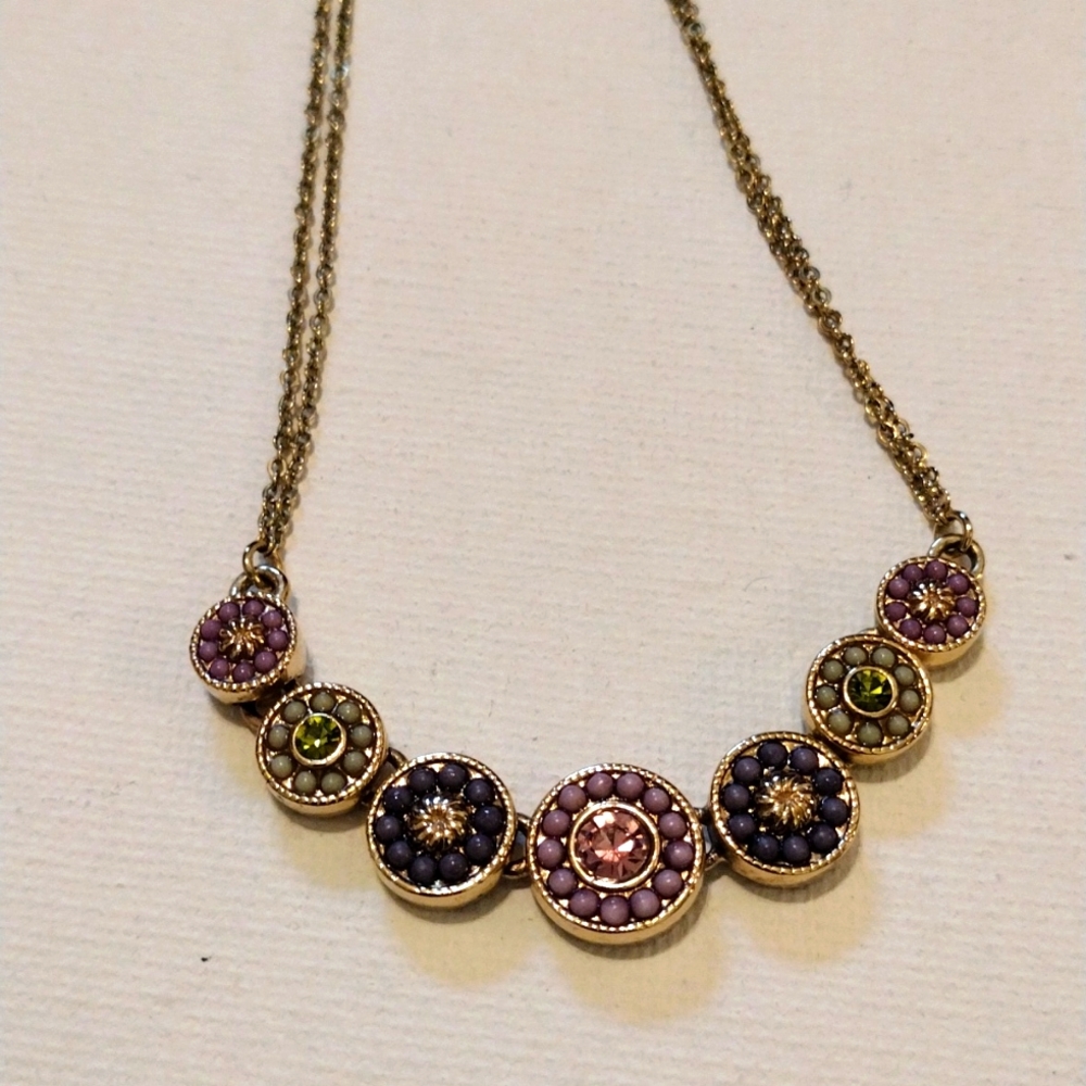 V beautiful linked charms necklace on double faux gold chain.